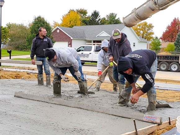 Contractors pouring concrete with contractors insurance in Miller City, OH